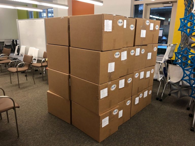 Boxes containing 2,000 assembled shields in Kenan Science Library