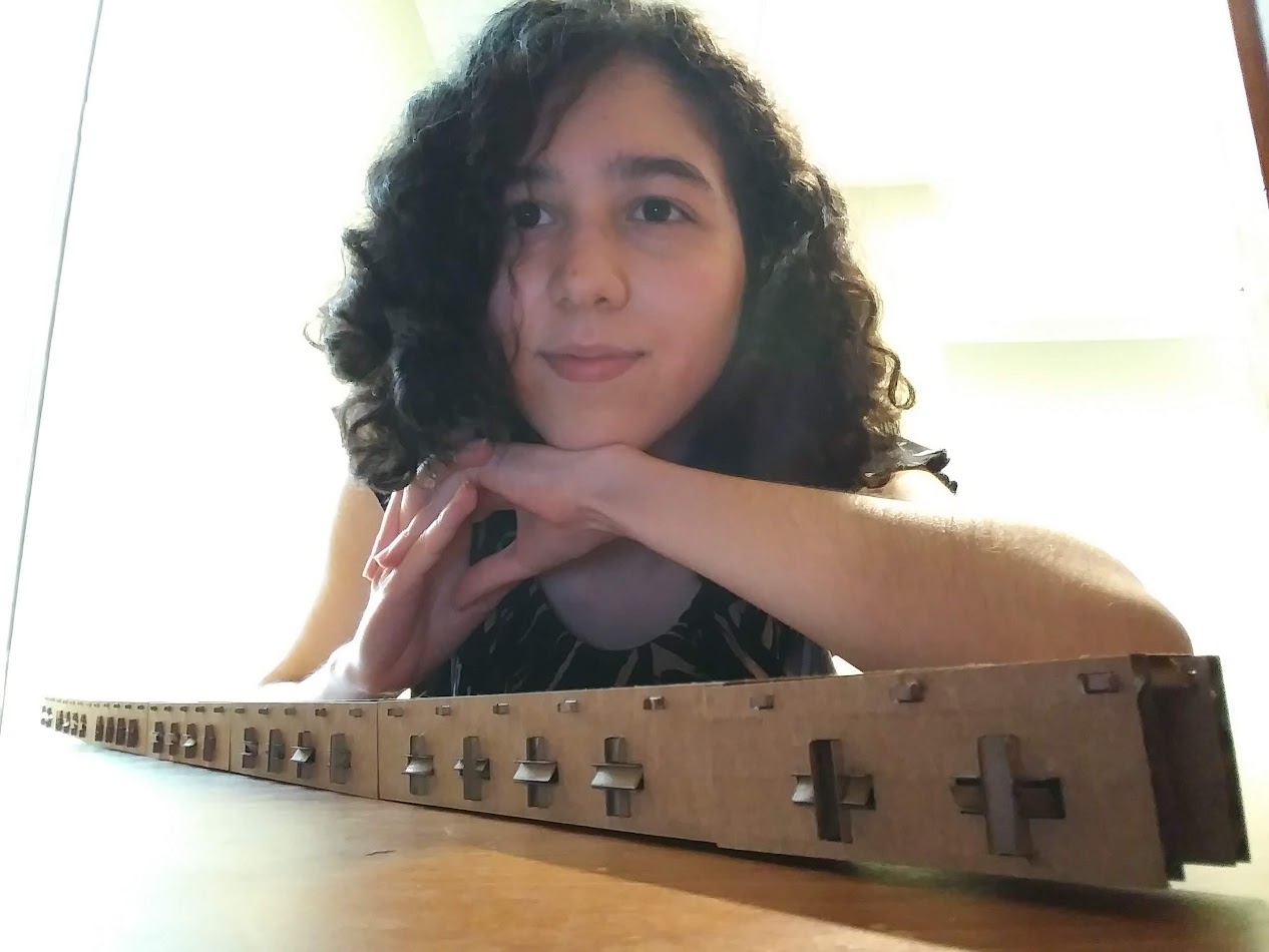 Martinez Leal and a cardboard bridge she created in APPL 110